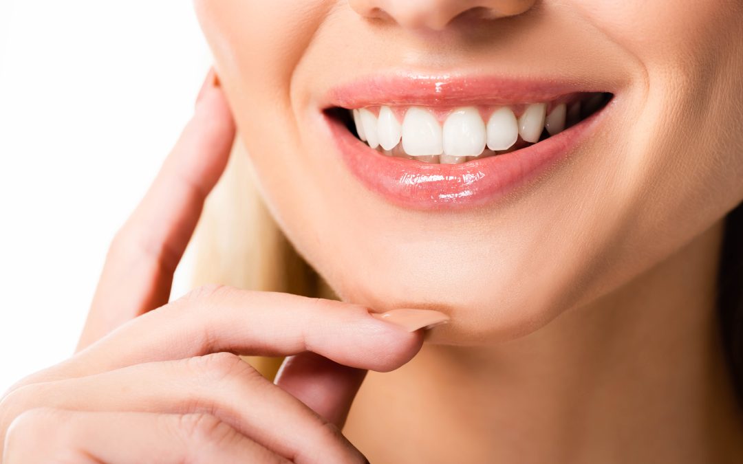 Dentist in Conyers using a visual aid to debunk myths about dental veneers damaging teeth.